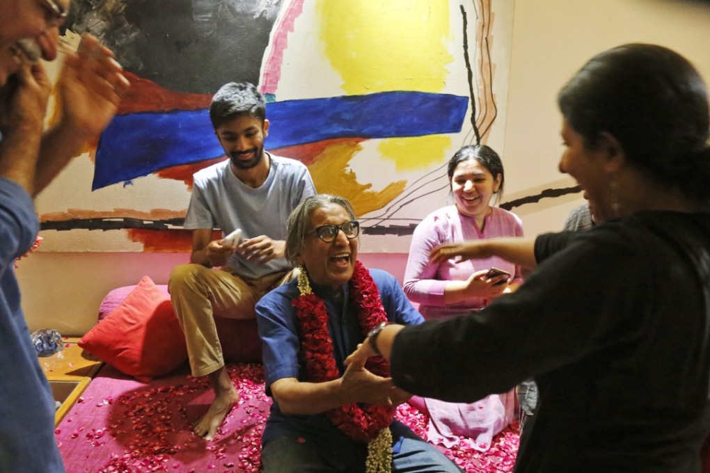 Balkrishna Doshi, centre in blue, winner of the 2018 Pritzker Architecture Prize, celebrates the announcement with his family members at his home in Ahmadabad, India, on Wednesday. Photo: AP