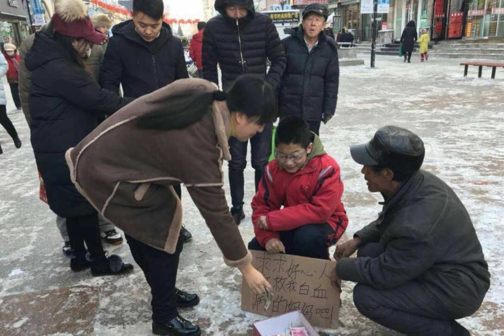 The boy was spotted while begging in a city square. Photo: Sohu.com