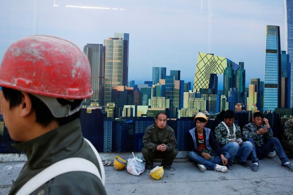 Cai Fang, the vice-president of the Chinese Academy of Social Sciences, said that Beijing could resolve its labour shortage problems by giving migrant workers equal rights to social and welfare benefits. Photo: Reuters