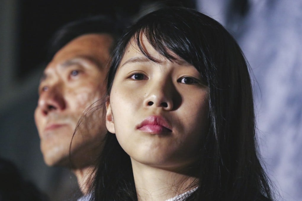 Agnes Chow Ting, barred from contesting the March 11 Legislative Council by-election, with Edward Yiu Chung-yim, who is running for Kowloon West, at a rally outside the Hong Kong government headquarters, in Admiralty on January 28. Photo: Felix Wong