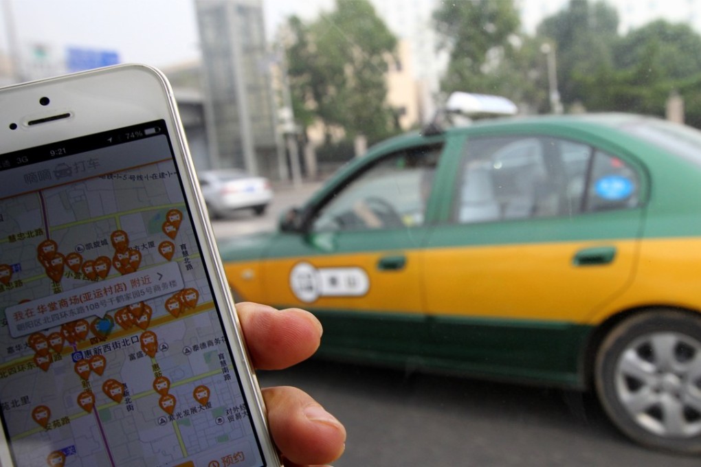 The screen of mobile phone shows the Didi app and available taxis for hailing in the area. Photo: SCMP