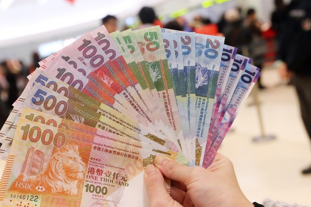 New banknotes for red packets for the Lunar New Year at a bank in Mong Kok on 27 January, 2016. Photo: SCMP/David Wong