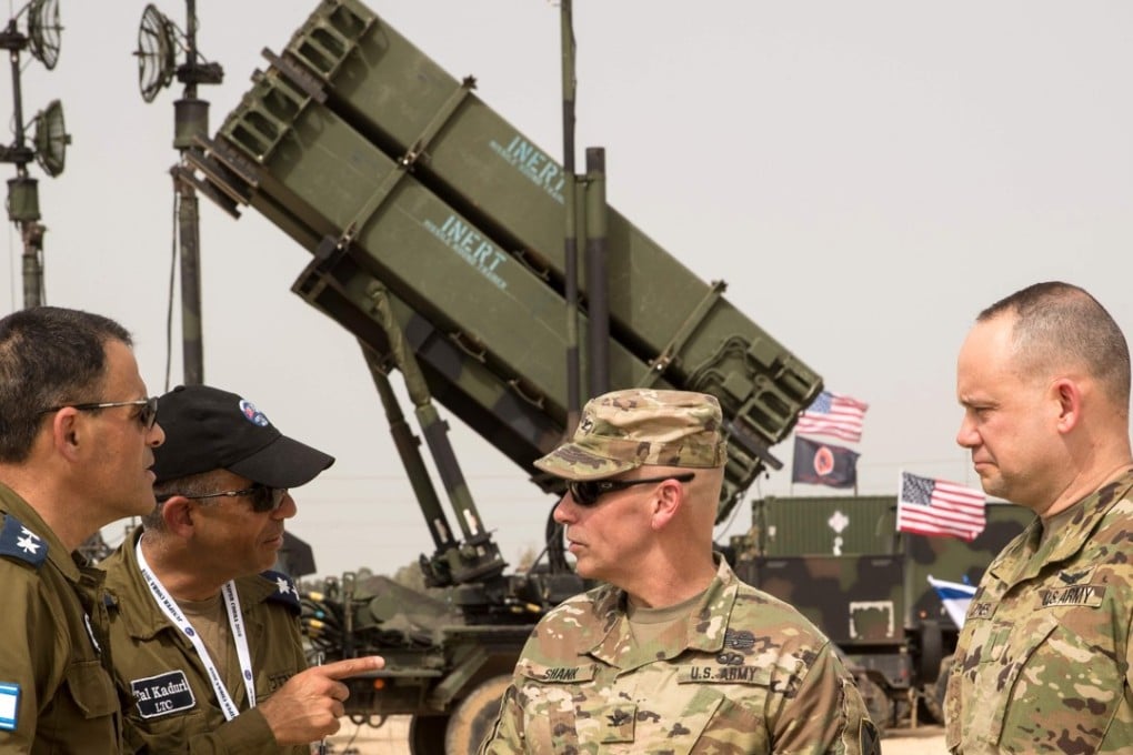 US and Israeli army officers talk in front a US Patriot missile defence system during the Israeli-US military exercise “Juniper Cobra” at the Hatzor Airforce base in Israel on March 8, 2018. Photo: AFP