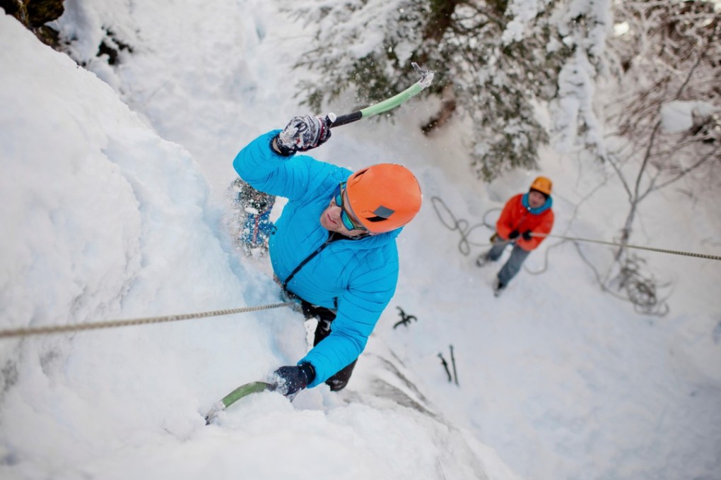 Sharp axes, crampons and safety equipment are all essential for ice climbing – especially a helmet to protect you from falling chunks of ice of varying sizes. Photo: Alamy