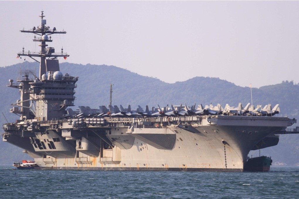China’s Foreign Minister Wang Yi on Thursday made a veiled reference to the United States flexing its muscles in the South China Sea with the arrival of a US aircraft carrier in Vietnam. Photo: AFP
