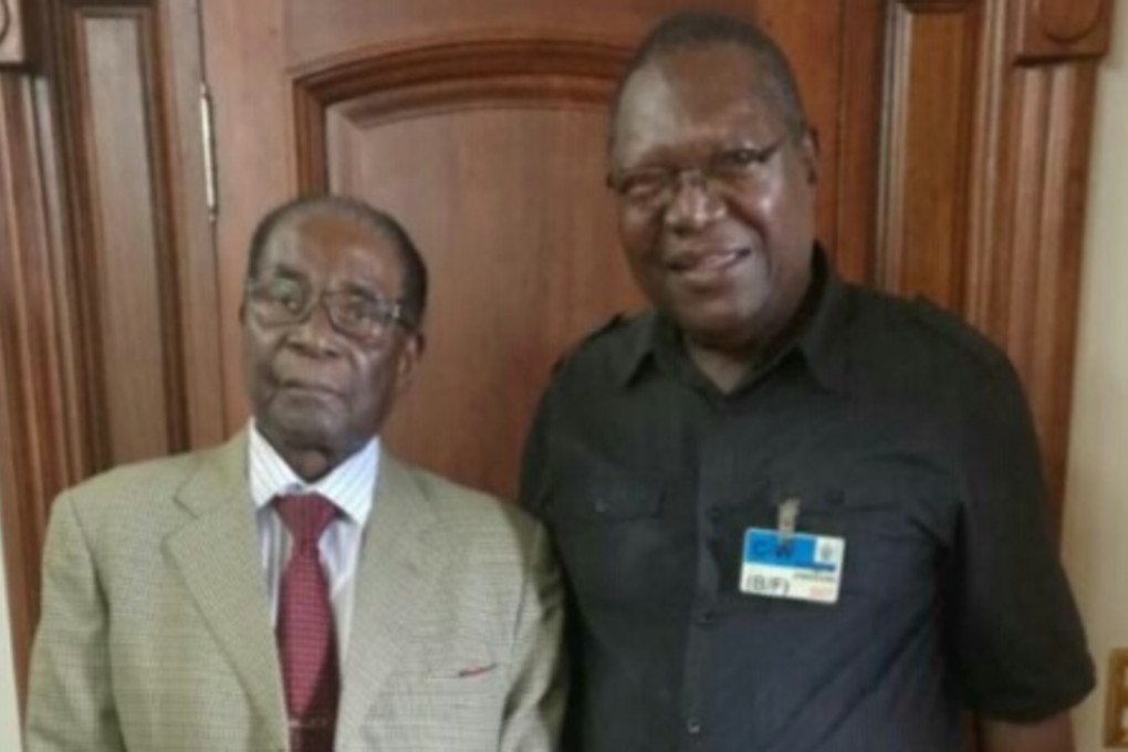 Robert Mugabe (left) and Brigadier General Ambrose Mutinhiri, the leader of Zimbabwe's opposition National Patriotic Front (NPF) party. Photo: NPF