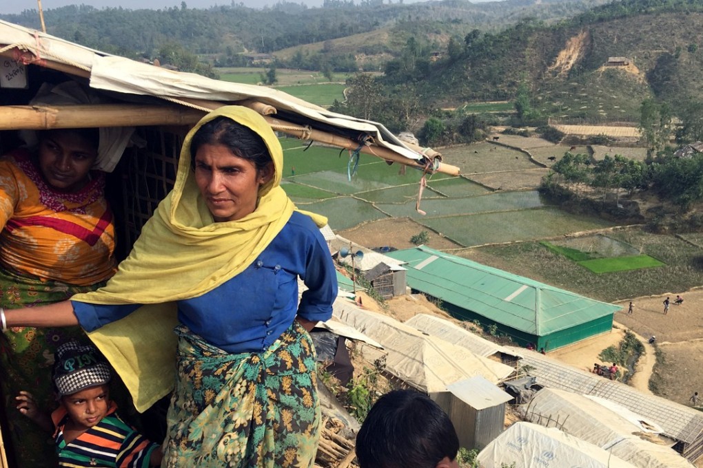 Rohingya refugee Arafa Begum, 40, stands outside her shack on a hillside in Chakmakul camp in southern Bangladesh, on February 8, 2018. The start of the annual monsoon could bring floods and landslides to refugee camps of Rohingya living on the border of Bangladesh. Photo: Reuters