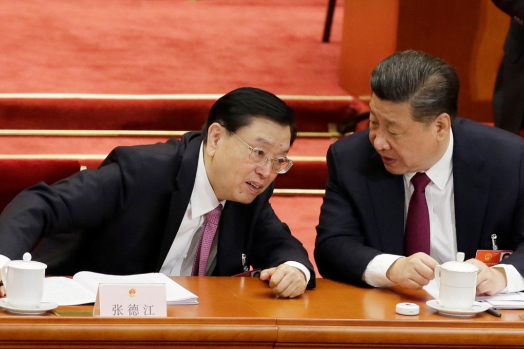 President Xi Jinping (right) talks to outgoing NPC chairman Zhang Dejiang, who is expected to announce the result of the vote. Photo: Reuters