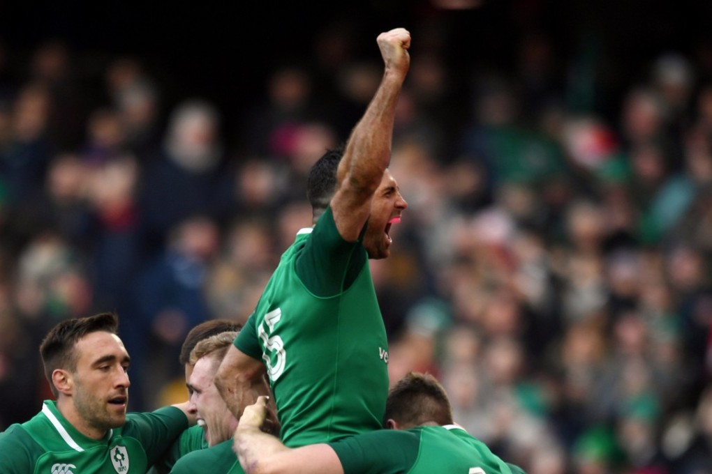 Ireland’s Rob Kearney celebrates with teammates after their fifth try against Wales. Photo: Reuters