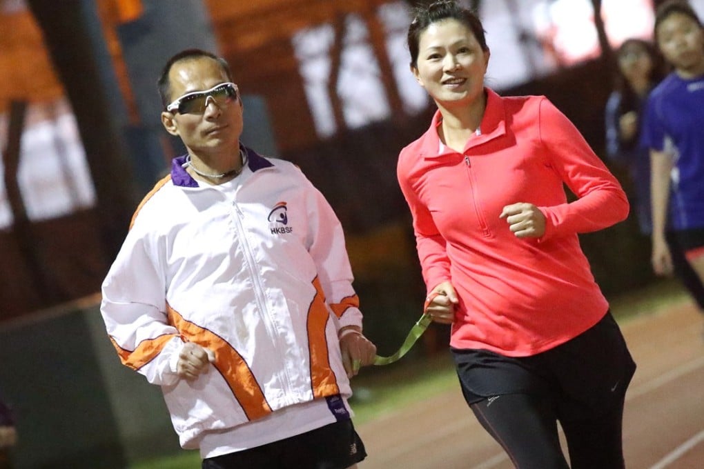Blind runner Gary Leung Siu-wai and his guide runner Joyce Chong training for the Hong Kong Marathon. But April’s North Pole Marathon is a very different challenge. Photo: K.Y. Cheng