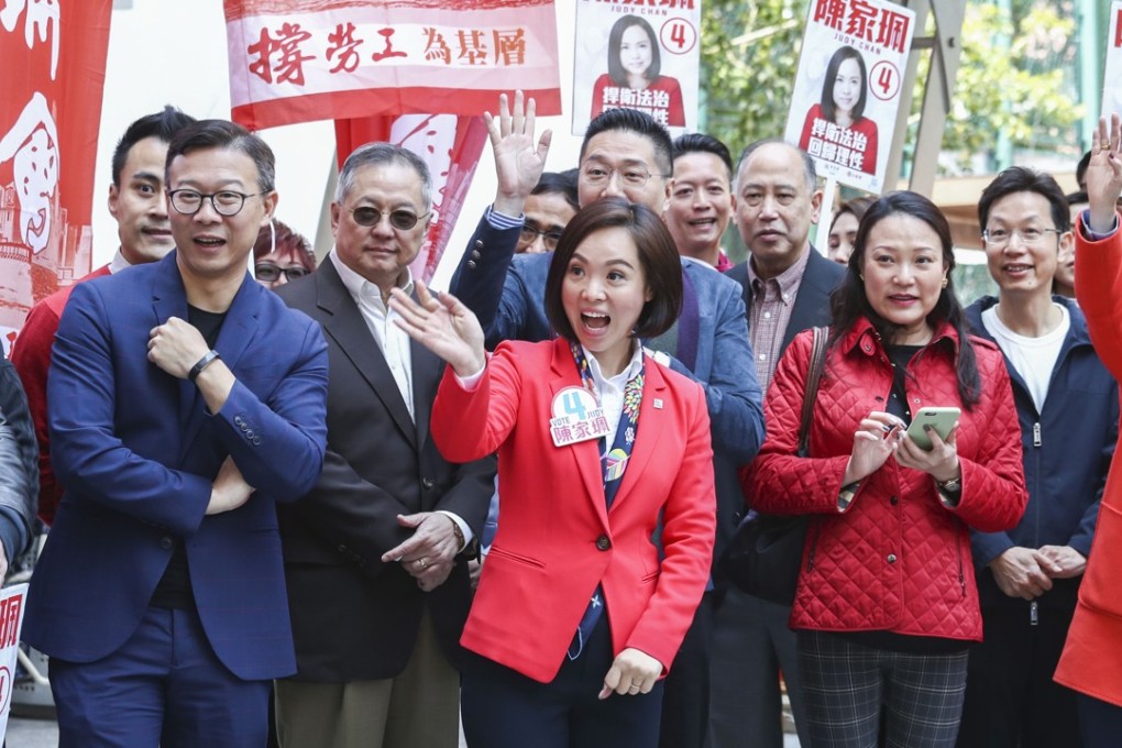 Legislative Council by-election candidate Judy Chan Ka-pui (centre) denied her campaign team was involved in the mystery calls to Cathay Pacific flight crew, urging those who had received calls to report them to police. Photo: Nora Tam