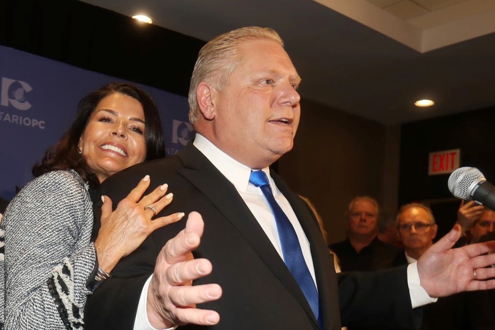 Progressive Conservatives leadership race candidate winner Doug Ford speaks with his wife Karla in Markham, Ontario, Canada. Photo: Reuters