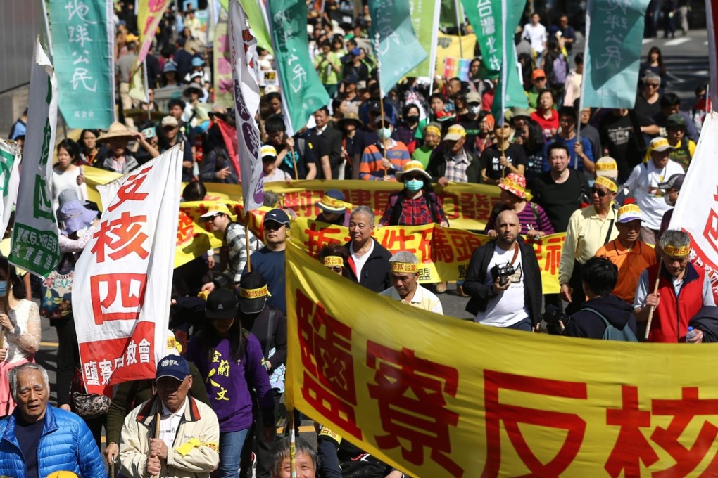 Activists march on Sunday during an annual protest against the use of nuclear energy in Taipei. Photo: AFP