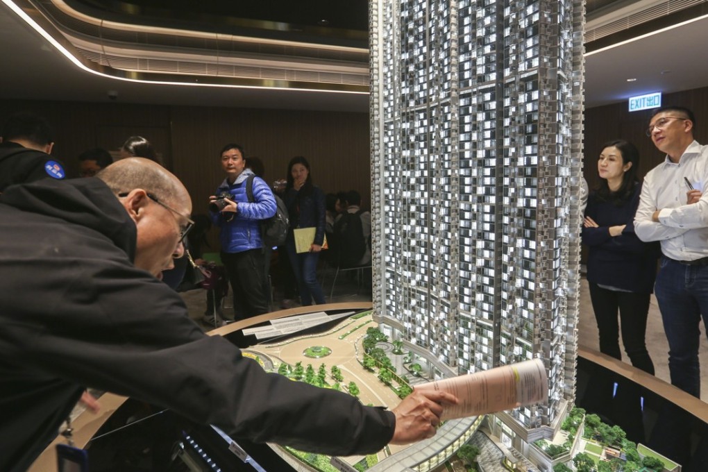 Potential buyers view a scale model of Wheelock’s Malibu project at Harbour City, in Tsim Sha Tsui, on Saturday. Photo: Xiaomei Chen