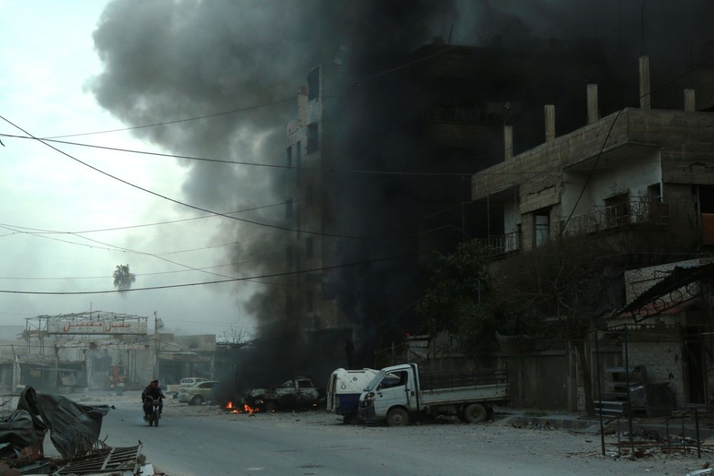 Heavy smoke billows following Syrian government bombardment in the town of Douma in the rebel-held enclave of Eastern Ghouta on the eastern outskirts of the capital Damascus on Saturday. Photo: Agence France-Presse