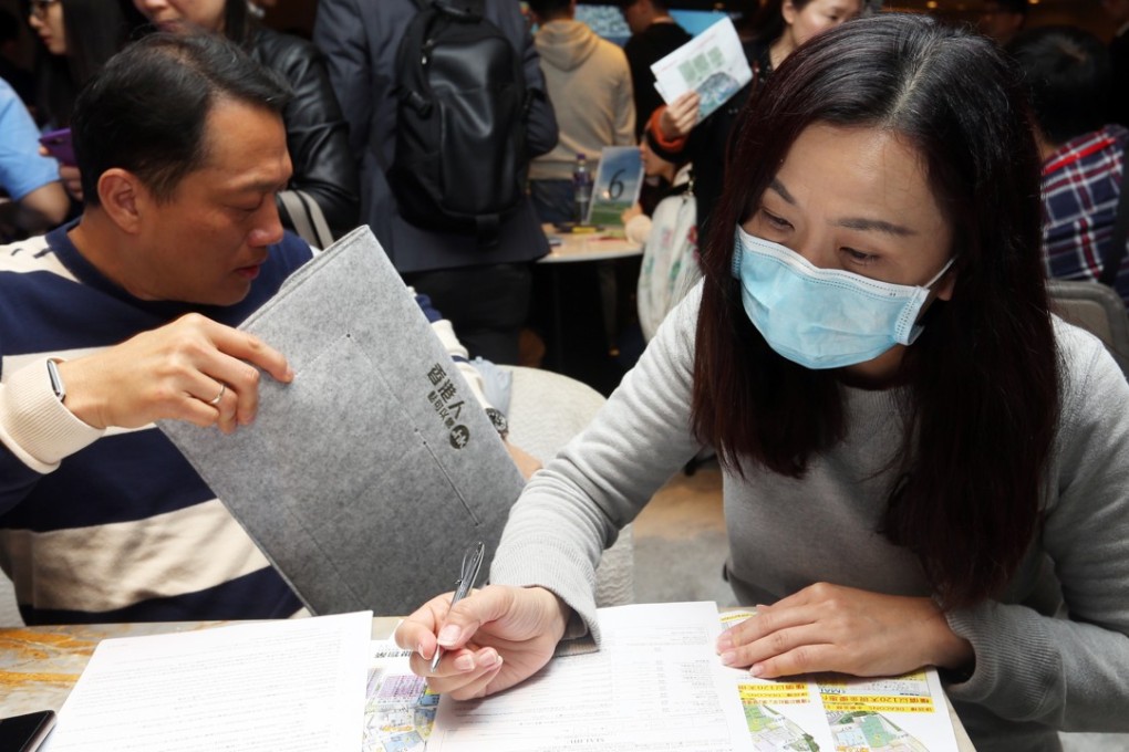 A buyer gets down to business on Saturday at the sales office for the Malibu development. Photo: Xiaomei Chen