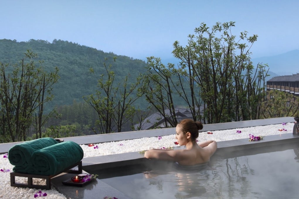 A guest relaxes in a private hot springs pool at Banyan Tree Chongqing Beibei, located in the hills near Chongqing city about a 50-minute car ride from the city’s airport.
