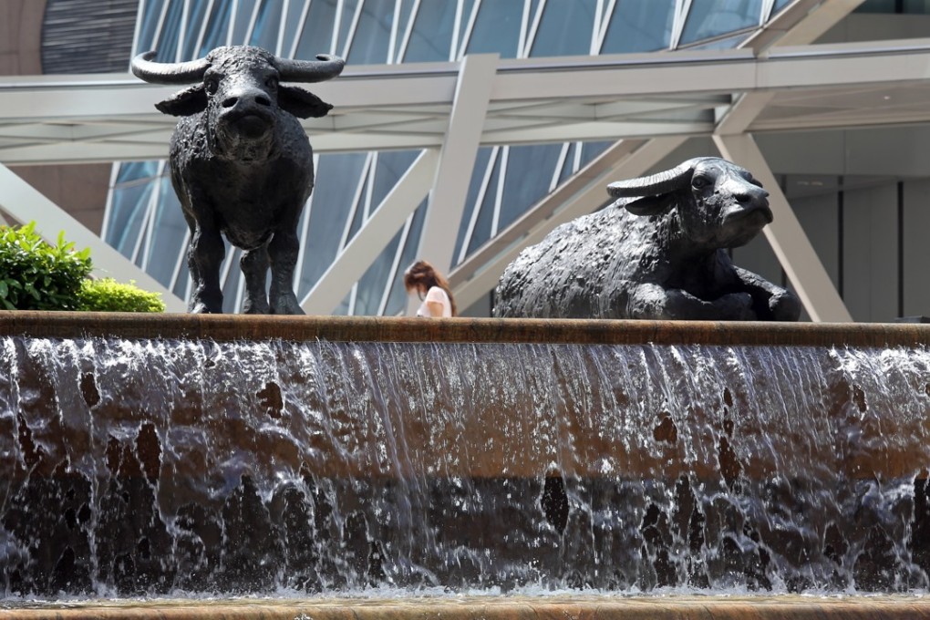 Outside the Hong Kong stock exchange. The inclusion of dual-listed shares on the main Hang Seng Index or the Hang Seng Composite Index, is expected to open the sluice gates to such applications to list by mainland companies. Photo: SCMP