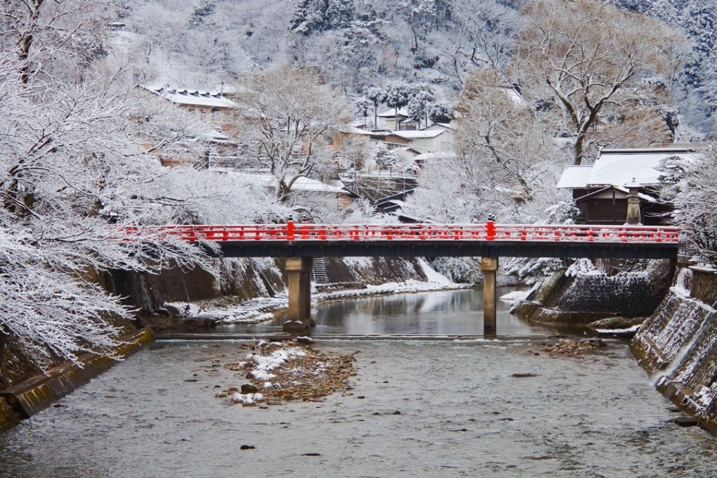 The brilliant red Nakabashi Bridge in Takayama, in Japan’s mountainous Gifu Prefecture, stands out against its winter backdrop.