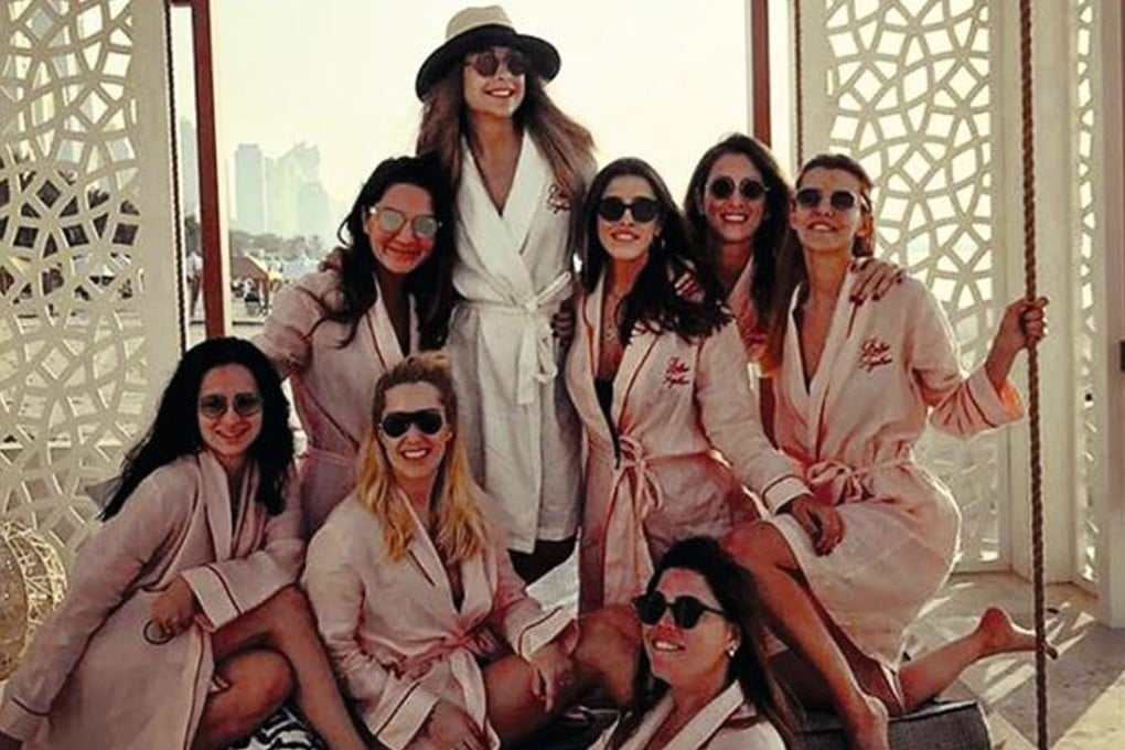 Mina Basaran (back centre) and her seven hen's night friends were all believed to have been killed in the plane crash. They are pictured in Dubai as they celebrated, in this image shared on Basaran's social media accounts just before the plane crash. Photo: Instagram / Mina Basaran