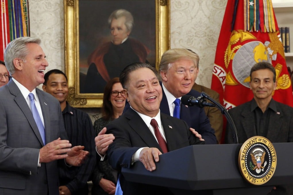 Broadcom CEO Hock Tan, pictured here at the White House with President Trump repatriated his company to the United States on November 2, 2017. But Trump issued an order to block Broadcom’s takeover of Qualcomm on March 12, 2018. Photo: Abaca Press/TNS