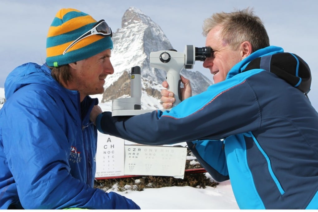 Nick Dash checks the eyes of Austrian climber Guido Unterwurzacher in front of the Matterhorn, in Switzerland.