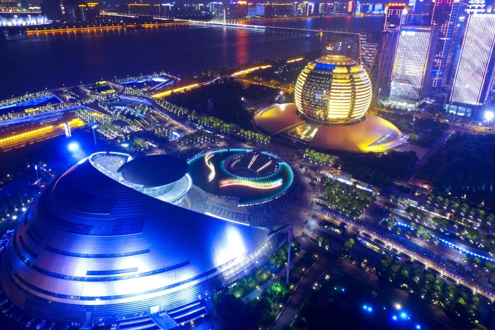 The InterContinental Hotel Hangzhou (in yellow) is pictured behind the Hangzhou Grand Theatre. Photo: Imaginechina