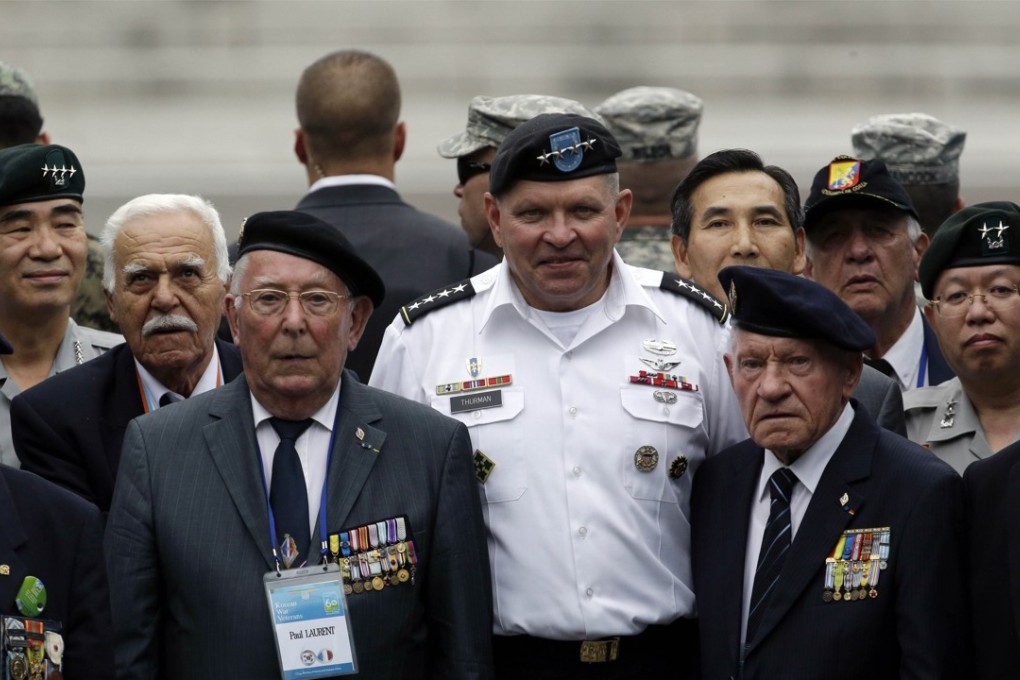 James Thurman, a retired Army general (centre), is one of two new candidates for the post of US ambassador to Seoul. Pictured: Thurman with Korean war veterans at the 60th anniversary of the Korean war armistice agreement. Photo: AP