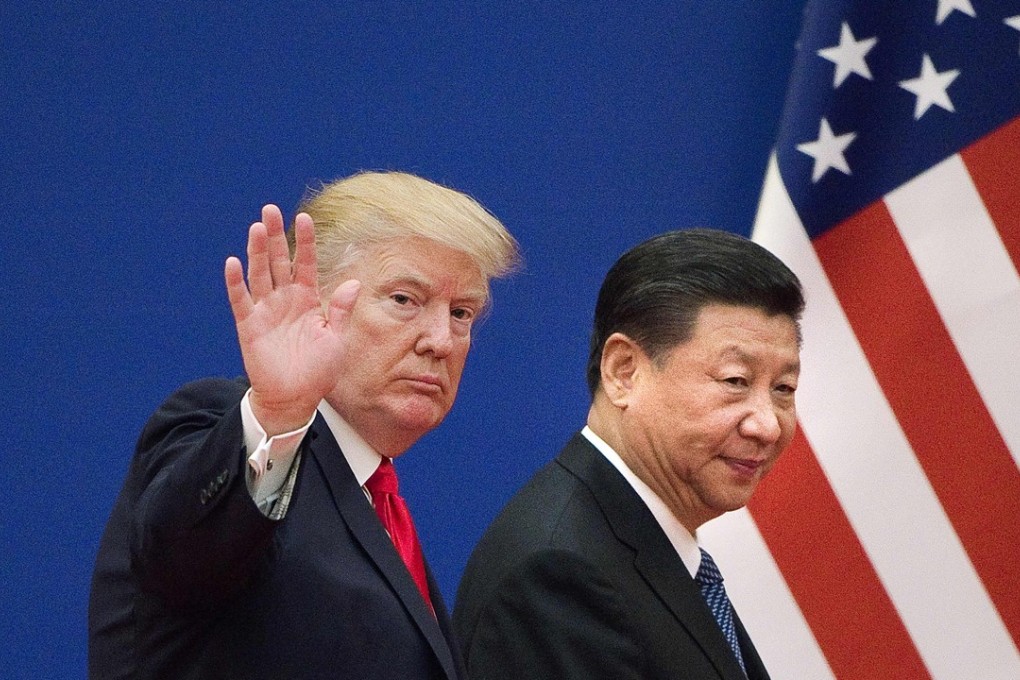 US President Donald Trump (left) and Chinese President Xi Jinping leave a business leaders event at the Great Hall of the People in Beijing on November 9, 2017. A trade war is looming between the two countries. Photo: AFP