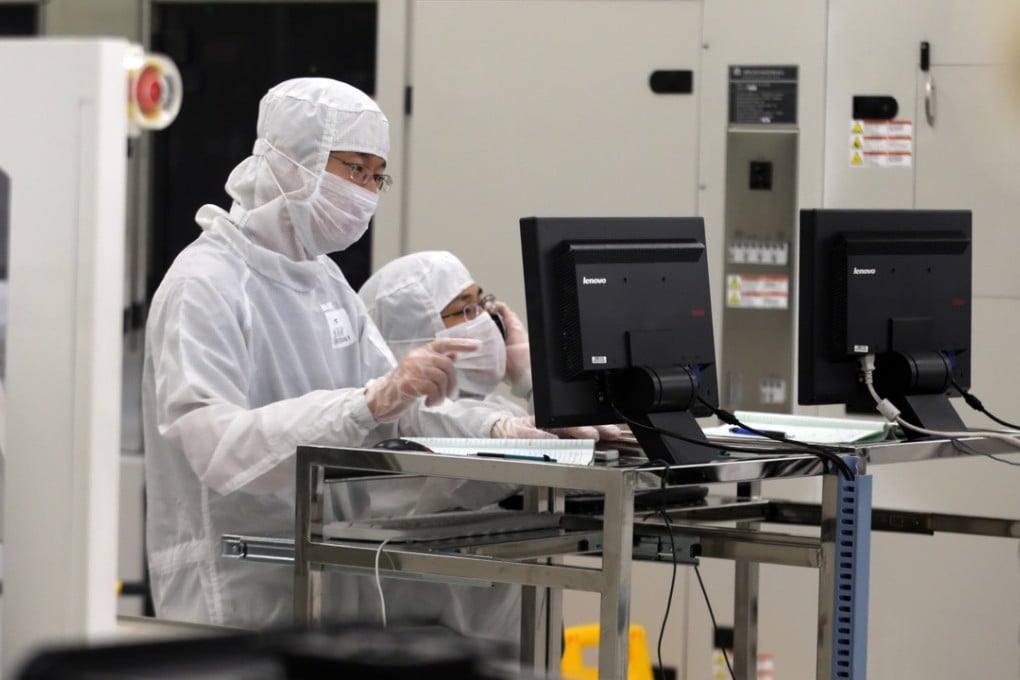 Chinese employees work in a Beijing semiconductor factory in this file photo. Chinese information technology, electronics and telecoms will the targets of a new raft of US tariffs, sources say. Photo: JH Photo