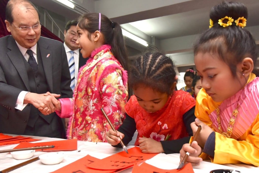 The chief secretary of Hong Kong, Matthew Cheung Kin-chung, meets ethnic minority children. Photo: Chief Secretary’s blog