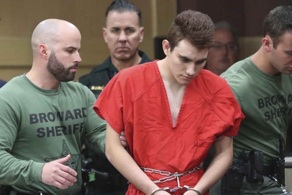 Nikolas Cruz is lead into the courtroom before being arraigned at the Broward County Courthouse in Fort Lauderdale, Florida, on Wednesday. Photo: Pool, South Florida Sun-Sentinel via AP
