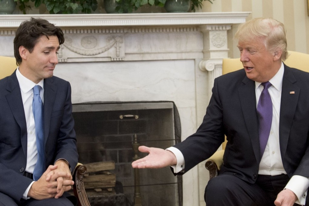 This file photo taken on February 13, 2017 shows US President Donald Trump and Canadian Prime Minister Justin Trudeau during a meeting in the Oval Office of the White House in Washington. Photo: Agence France-Presse