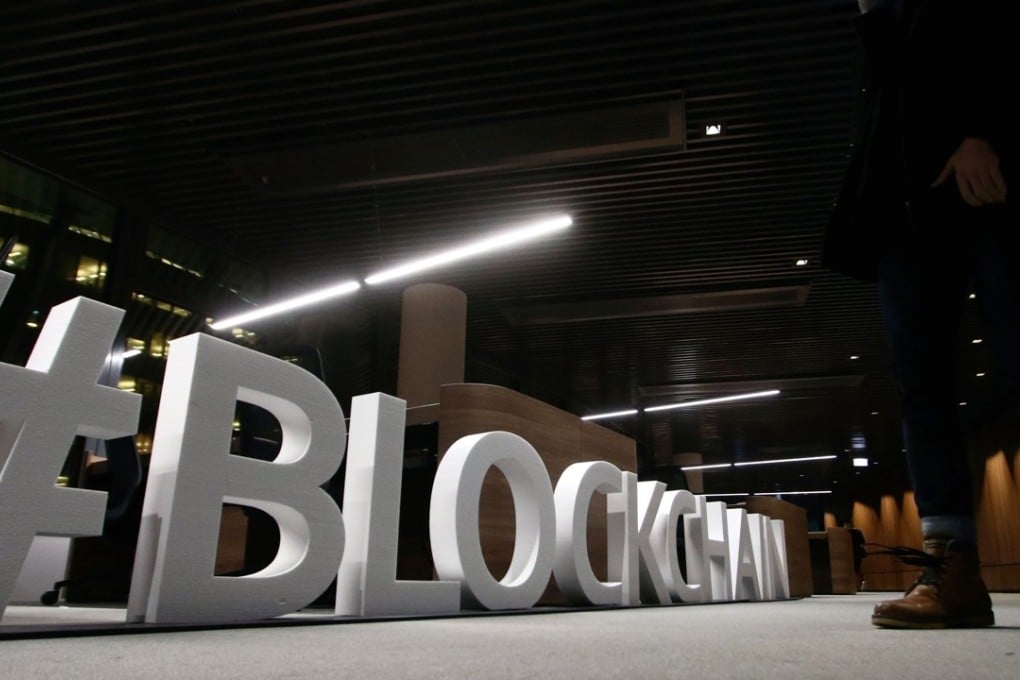 Giant letters, reading the word “blockchain” on display at the blockchain centre, which aims at boosting start-ups in Lithuania's capital Vilnius. Peter Guy argues that e-commerce development in Hong Kong is being stifled by the bureaucrats at the HKMA, who are resisting any opportunity and perceived risk to innovate. Photo: AFP
