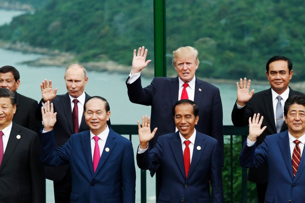 China's President Xi Jinping (Front row left), Russian President Vladimir Putin (back row second left) and US President Donald Trump (back row second right) during the Asia-Pacific Economic Cooperation (APEC) leaders' summit in the central Vietnamese city of Da Nang on November 11, 2017. Photo: AFP PHOTO / POOL / JORGE SILVA
