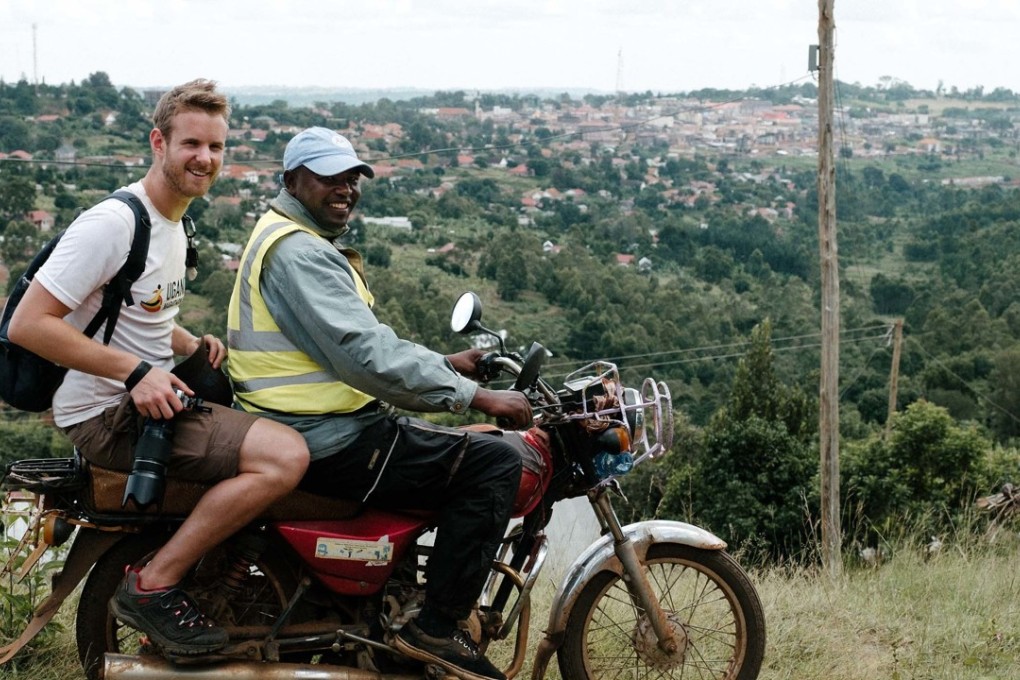 Uganda – Spent the day on the back of a motorcycle (boda) to photograph the Uganda Marathon. Sometimes using my rucksack to strap myself to the driver so I could face backwards and photograph as we moved. Photo: Richard Tilney-Bassett