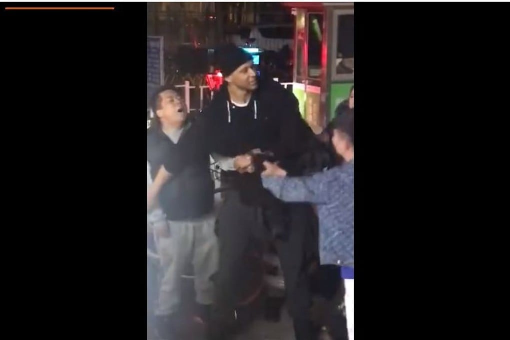 Beijing Ducks centre Randolph Morris acts as peacemaker in a Beijing street fight. Photo: Sina Weibo