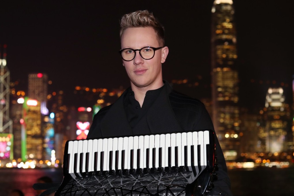 Martynas Levickis, an accordion player, poses for a portrait in Tsim Sha Tsui. Picture: K. Y. Cheng