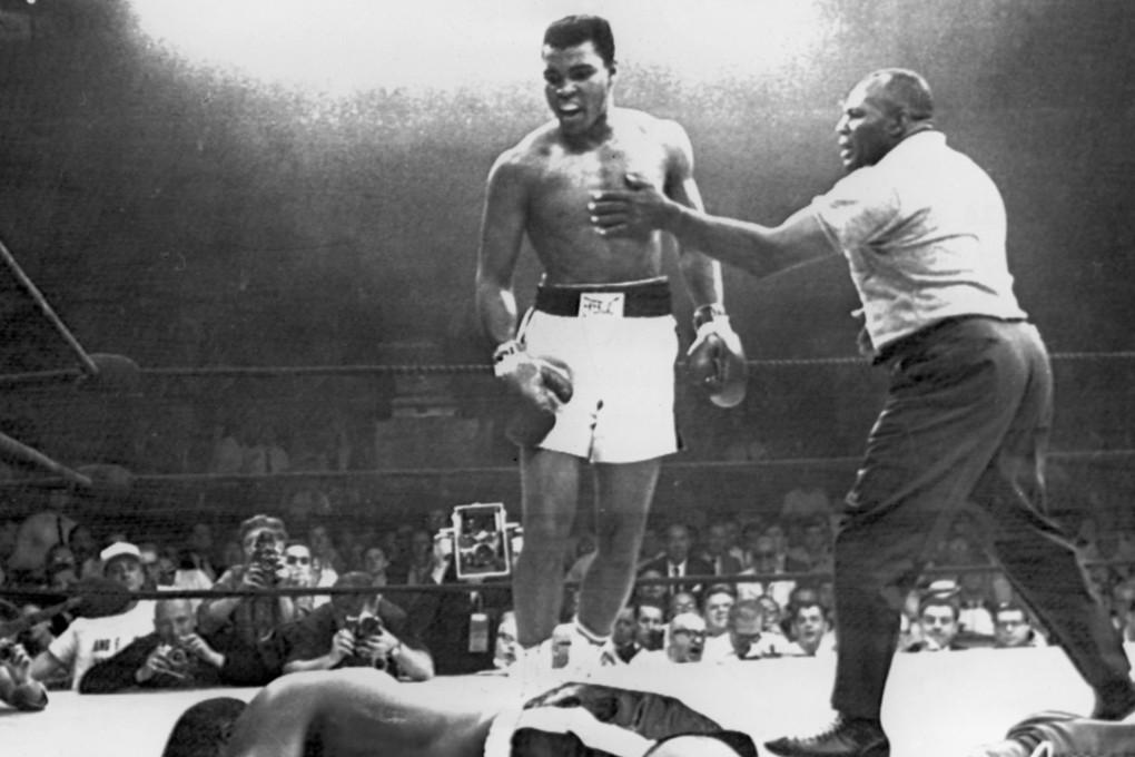 Muhammad Ali (centre) knocks out challenger Charles "Sonny" Liston in 1965. Picture: AFP