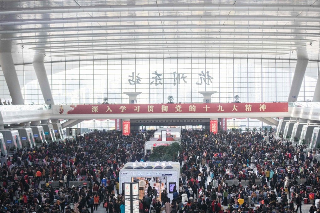 Thousands of rail passengers line up to board trains at Hangzhou East Railway Station in Hangzhou, in eastern China's Zhejiang province, in February during the Lunar New Year travel rush. China said it will begin applying its social credit system to trains and flights, and stop people who have committed misdeeds from taking such transport for up to a year. Photo: Agence France-Presse