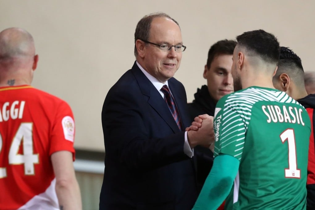 The real Prince Albert II of Monaco greeting players at the end of a football match between Monaco and Lille. Photo: AFP