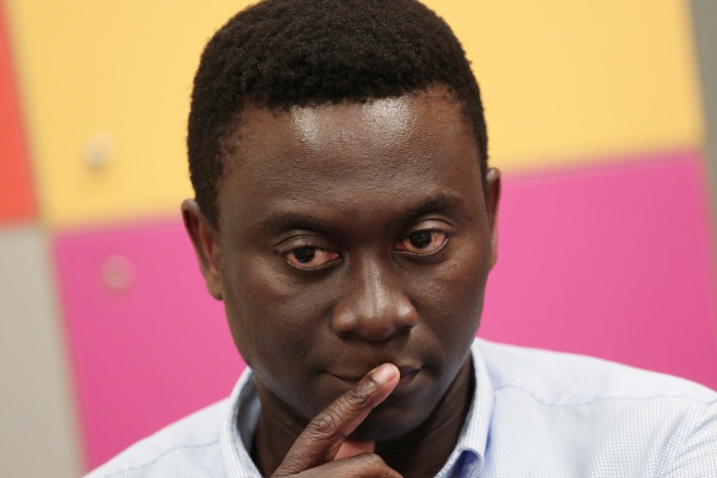 Roy Njuabe, 40, a pastor at a Hong Kong church and a father of two. Photo: Jonathan Wong