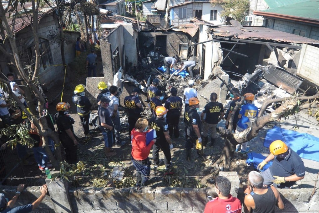 Rescuers at the site of the crash. Photo: AFP