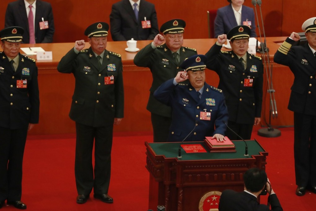 Newly appointed vice-chairman of the Central Military Commission Xu Qiliang (at podium) leads the military oath-taking ceremony at the National People’s Congress in Beijing on Sunday. Also pictured are CMC vice-chairman Zhang Youxia (back row, centre) and regular members (from left) Zhang Shengmin, Li Zuocheng, Wei Fenghe and Miao Hua. Photo: EPA-EFE