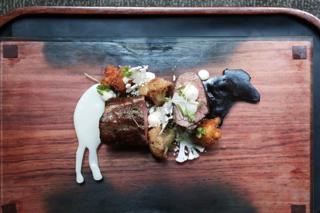 Based on the installation One of You. Organic lamb loin with sliced and purée of cauliflower and black garlic purée. Photo: Jonathan Wong