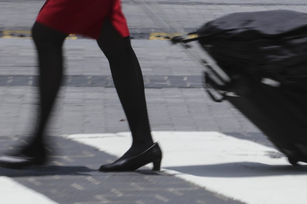 All four of Hong Kong’s airlines require female cabin crew to wear skirts. Photo: Felix Wong