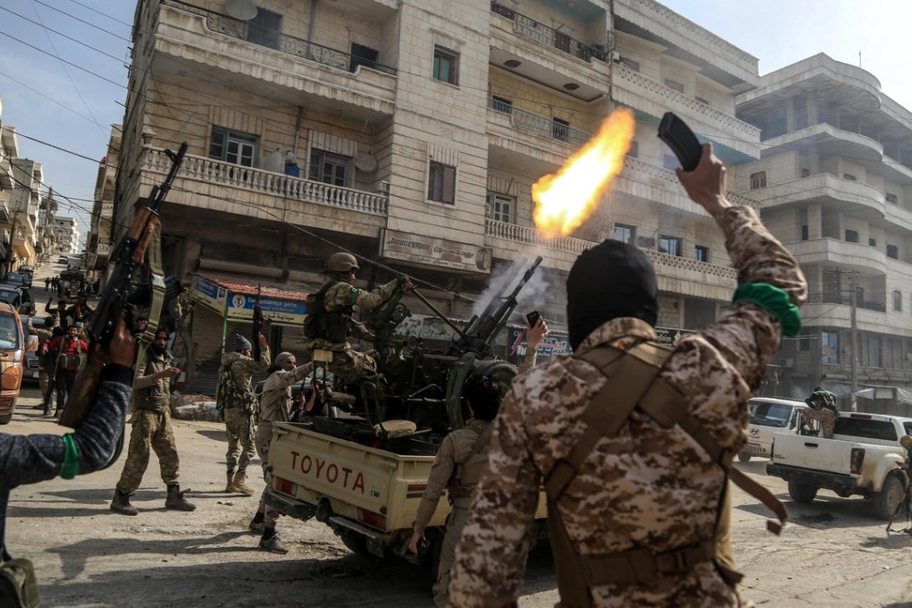 Turkish-backed Free Syrian Army soldiers fire in the air as they celebrate after reportedly capturing the city of Afrin, northern Syria. Photo: EPA