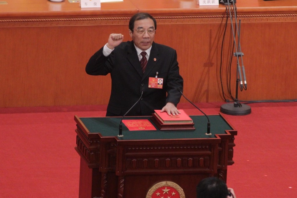Yang Xiaodu swears in as chairman of the National Supervisory Commission at the National People’s Congress in Beijing on Sunday. Photo: Simon Song