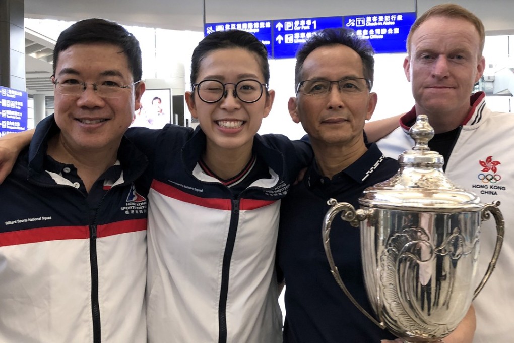 Ng On-yee arrives in Hong Kong with coach Alan Wong Tak-wah (left), father Ng Yam-shui and head coach Wayne Griffiths (right). Photo: Chan Kin-wa