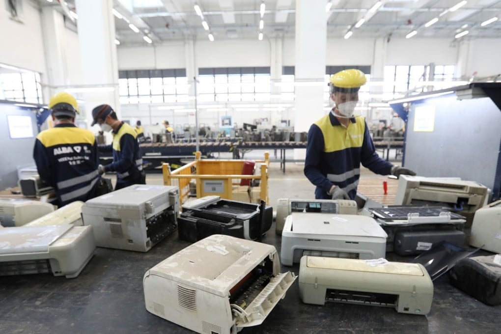 Staff working at the Hong Kong government's Waste Electrical and Electronic Equipment facility in Tuen Mun. Photo: Edward Wong